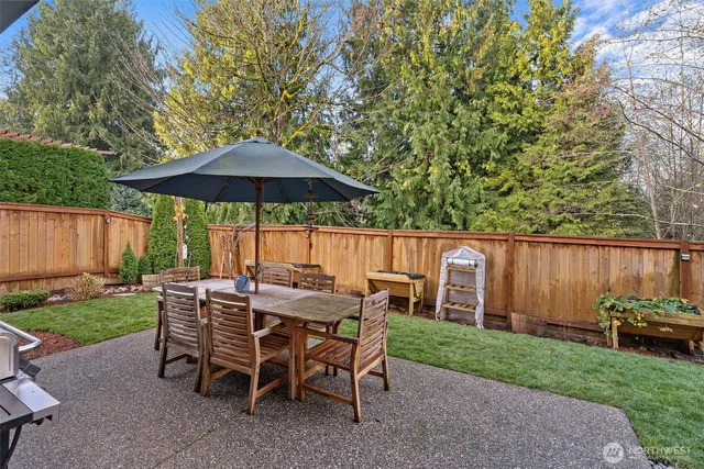 a patio with a patio table and chairs