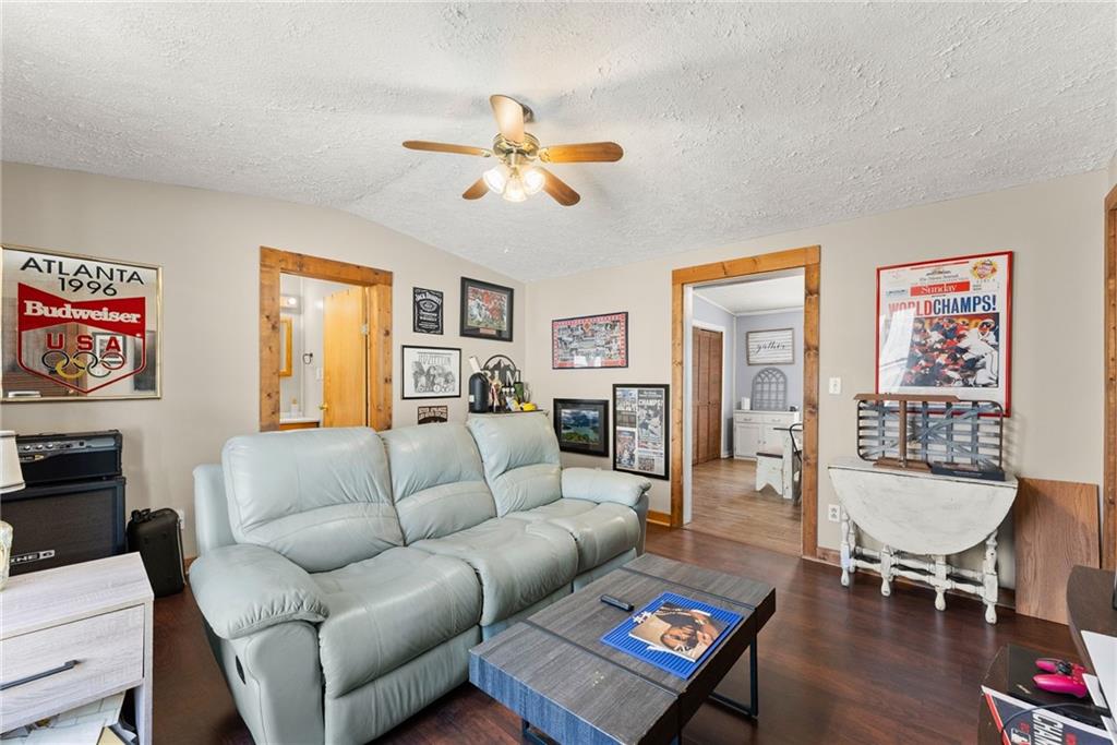 2000 Dr Bramblett Road Cumming, GA 30040 - Photo 13 of 37 a living room with furniture a flat screen tv and a window