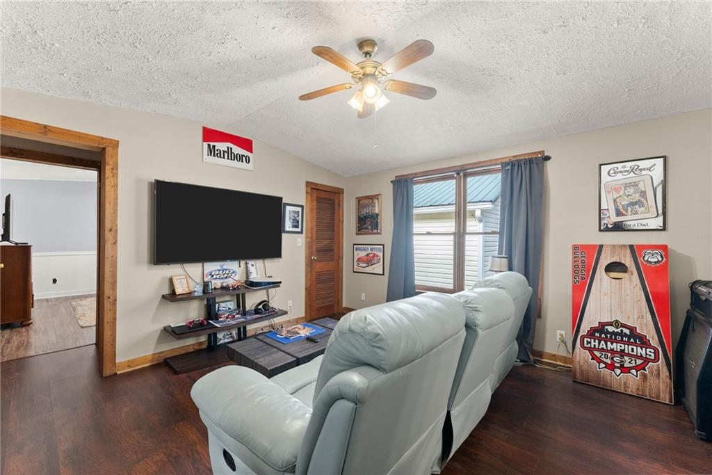 2000 Dr Bramblett Road Cumming, GA 30040 - Photo 14 of 37 a living room with furniture and a flat screen tv