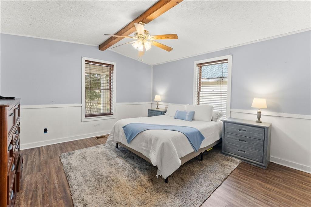 2000 Dr Bramblett Road Cumming, GA 30040 - Photo 15 of 37 a spacious bedroom with a bed and a window