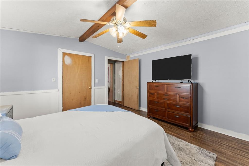 2000 Dr Bramblett Road Cumming, GA 30040 - Photo 16 of 37 a bedroom with a bed and a flat screen tv