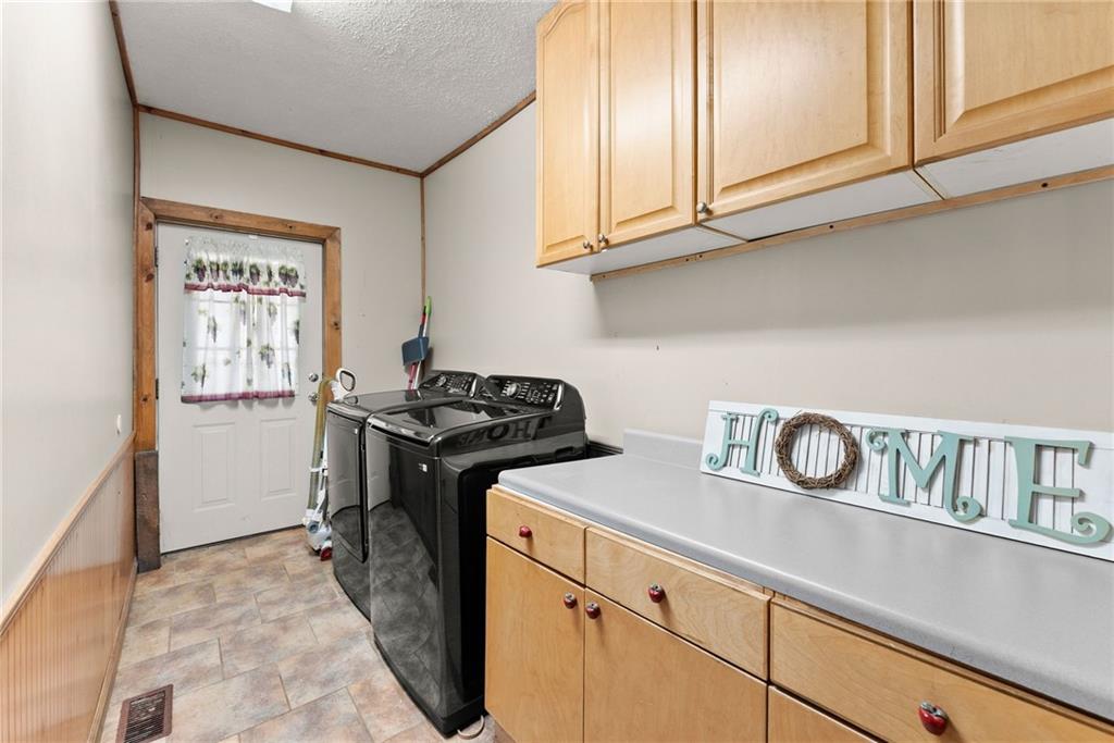 2000 Dr Bramblett Road Cumming, GA 30040 - Photo 23 of 37 a utility room with sink dryer and washer