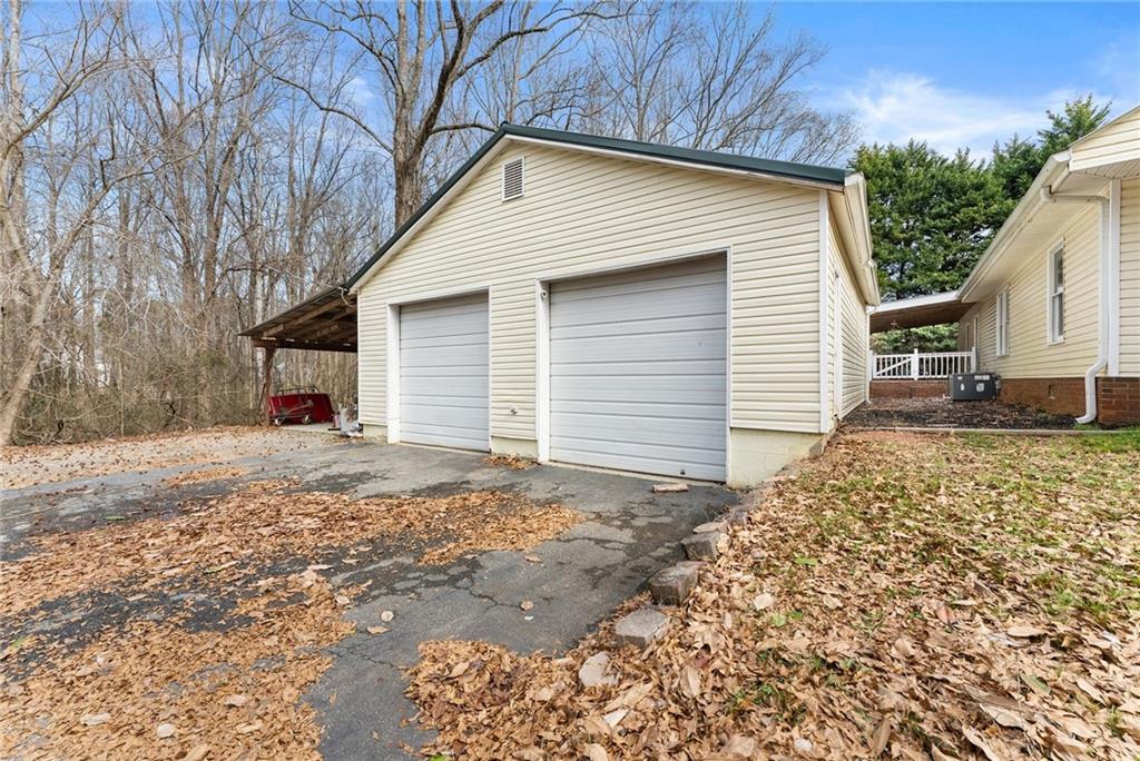 2000 Dr Bramblett Road Cumming, GA 30040 - Photo 24 of 37 a view of a house with a yard