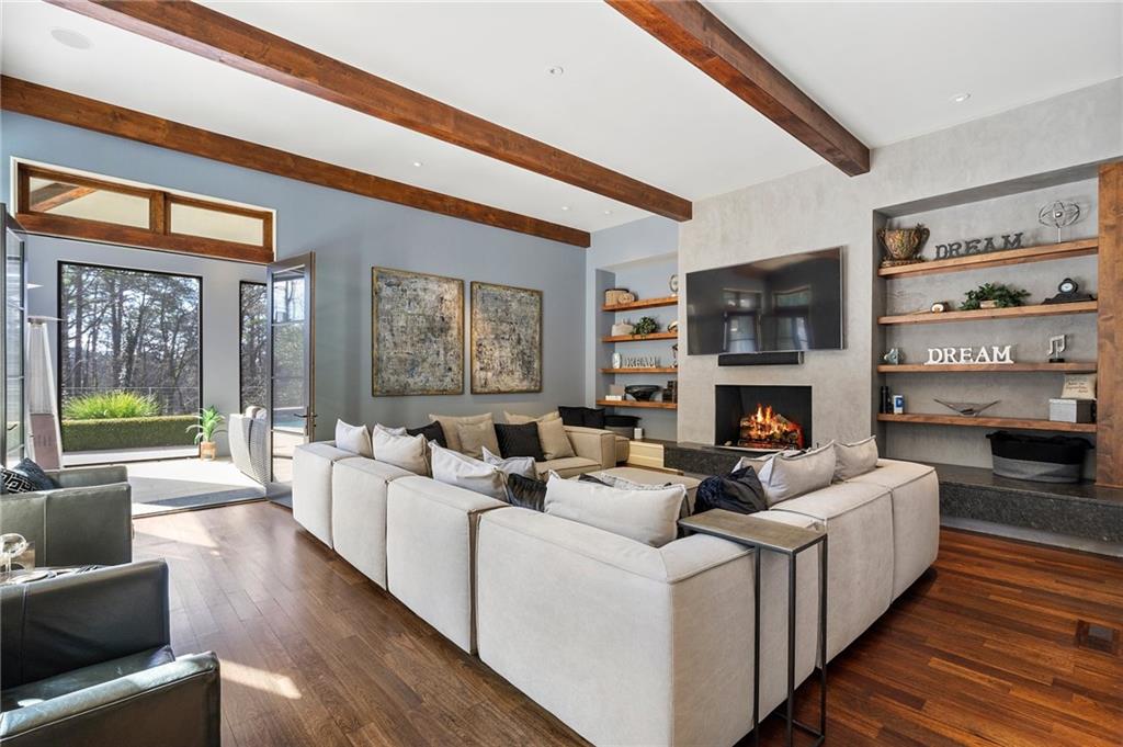 1500 West Wesley Road Northwest Atlanta, GA 30327 - Photo 19 of 60 a living room with furniture a fireplace and a large window