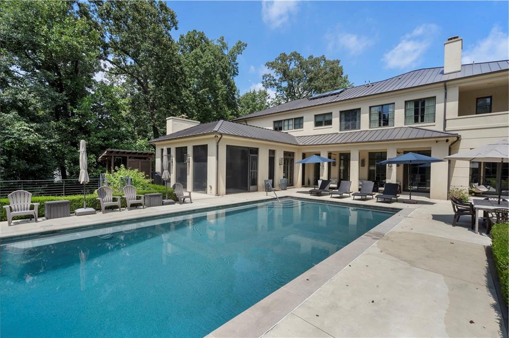 1500 West Wesley Road Northwest Atlanta, GA 30327 - Photo 22 of 60 a view of a house with swimming pool