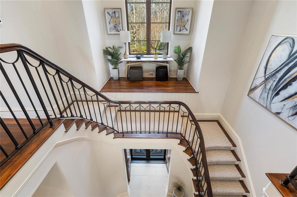 1500 West Wesley Road Northwest Atlanta, GA 30327 - Photo 25 of 60 a view of staircase with white walls and a window