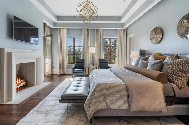 a view of a patio with a table chairs and a barbeque