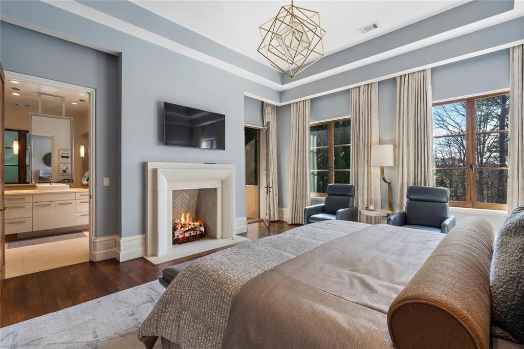 1500 West Wesley Road Northwest Atlanta, GA 30327 - Photo 28 of 60 a bed room with a bed and a television