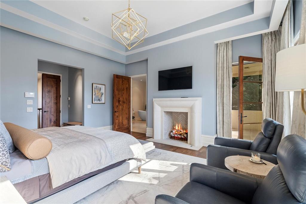 1500 West Wesley Road Northwest Atlanta, GA 30327 - Photo 29 of 60 a bedroom with a bed a couch and dresser