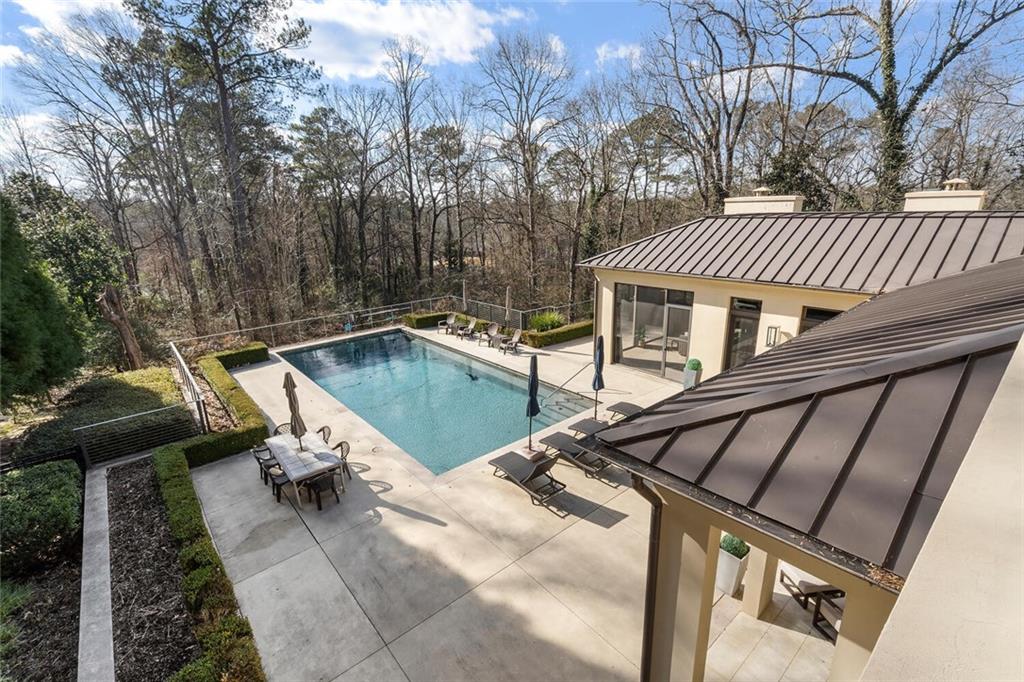 1500 West Wesley Road Northwest Atlanta, GA 30327 - Photo 31 of 60 a view of a patio with a table chairs and a barbeque