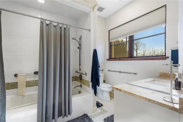 a utility room with sink dryer and washer