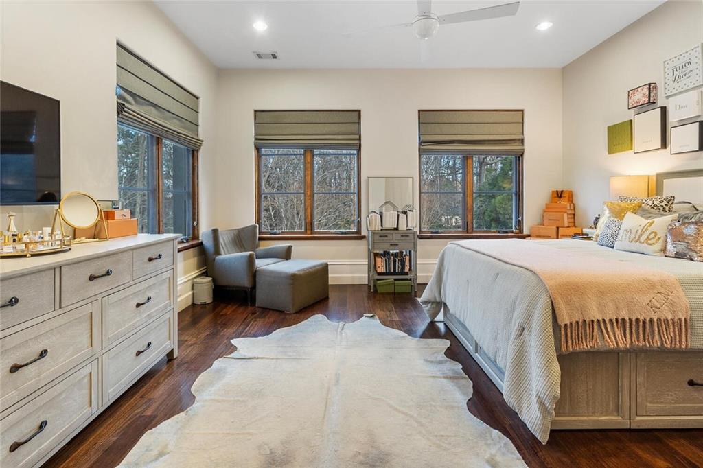 1500 West Wesley Road Northwest Atlanta, GA 30327 - Photo 37 of 60 a spacious bedroom with a bed and large windows