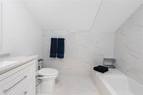 a en suite bathroom with a sink and a mirror