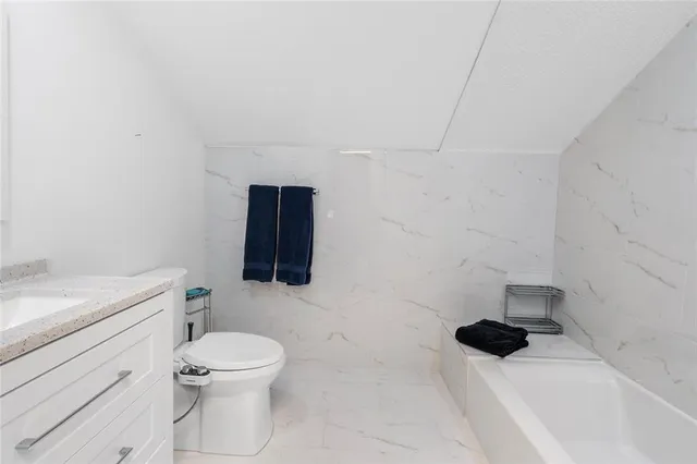 a en suite bathroom with a sink and a mirror