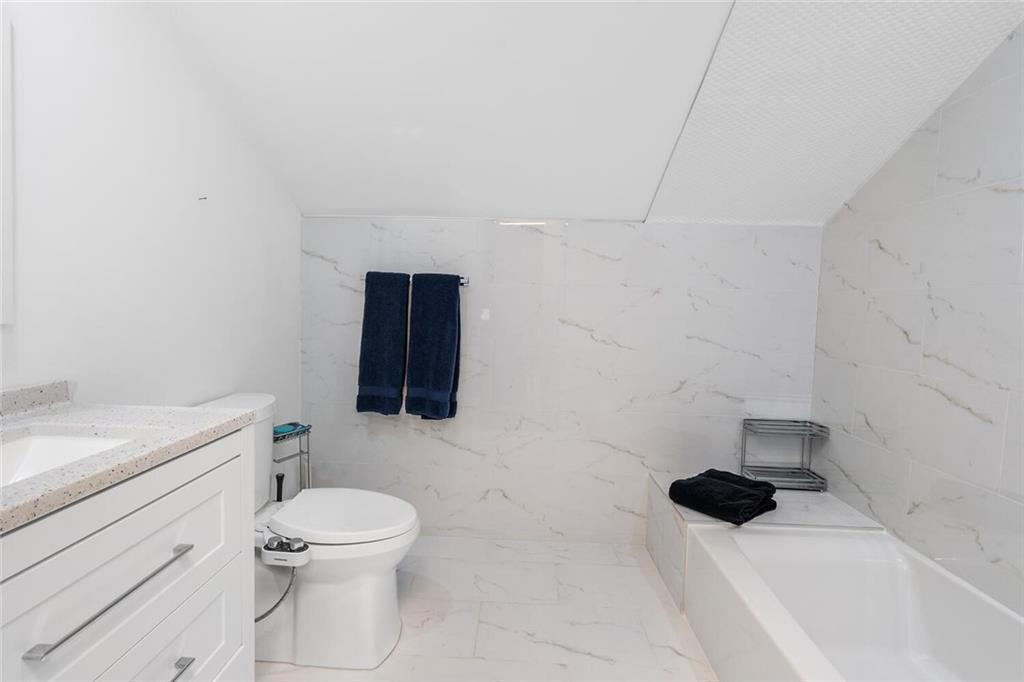 1500 West Wesley Road Northwest Atlanta, GA 30327 - Photo 40 of 60 a bathroom with a toilet and a sink