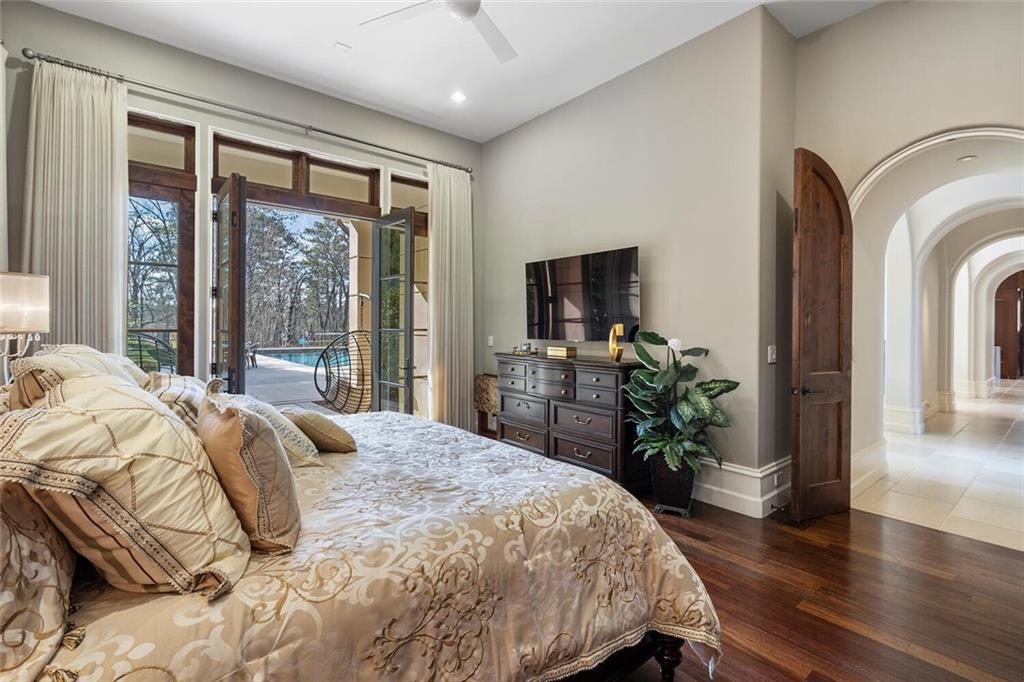 1500 West Wesley Road Northwest Atlanta, GA 30327 - Photo 45 of 60 a bedroom with a bed and a potted plant