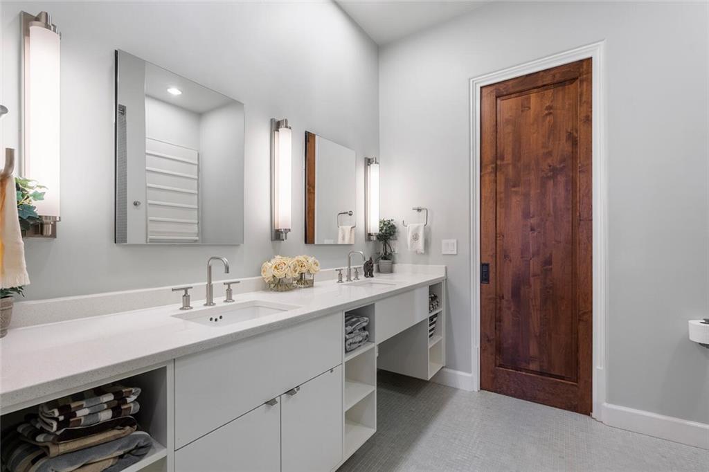 1500 West Wesley Road Northwest Atlanta, GA 30327 - Photo 46 of 60 a bathroom with a double vanity sink a and a mirror