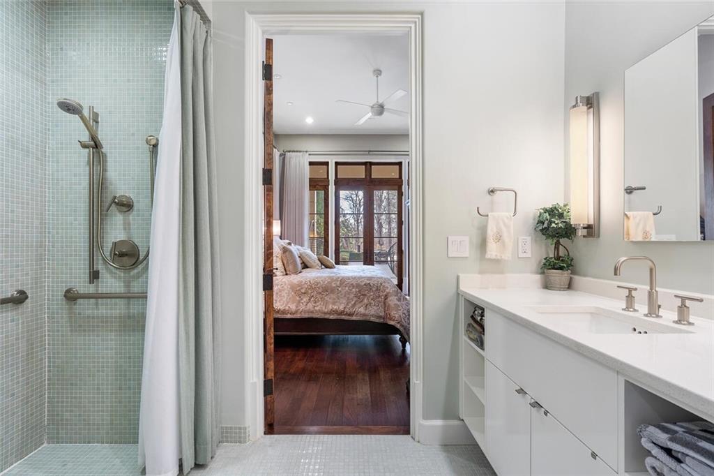 1500 West Wesley Road Northwest Atlanta, GA 30327 - Photo 47 of 60 a en suite bathroom with a sink and a mirror