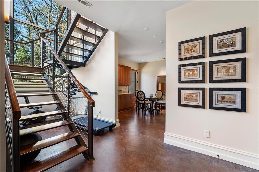 1500 West Wesley Road Northwest Atlanta, GA 30327 - Photo 50 of 60 a view of a livingroom with furniture and stairs