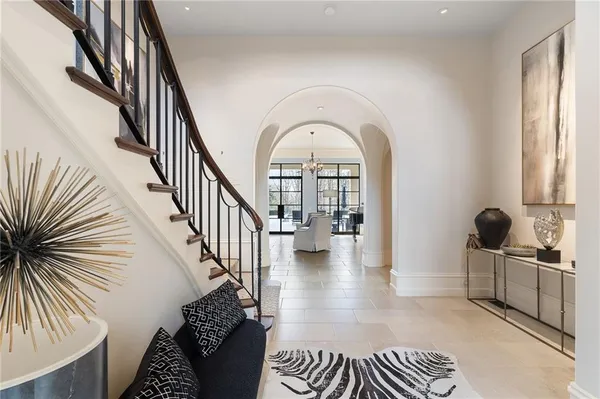 a view of entryway and hall with wooden floor