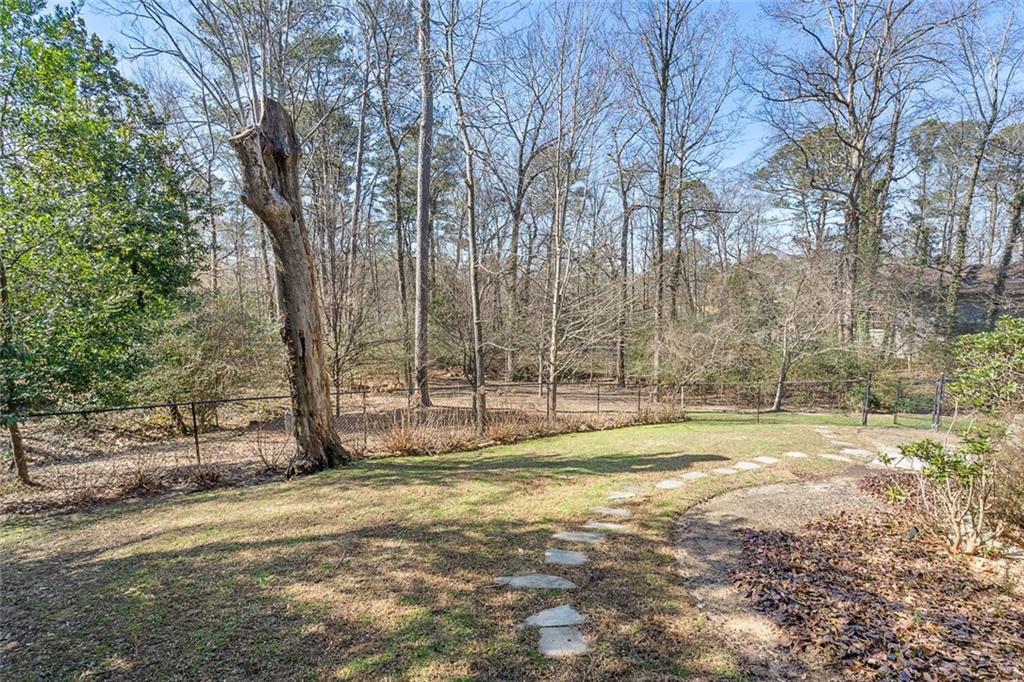 1500 West Wesley Road Northwest Atlanta, GA 30327 - Photo 59 of 60 a view of a backyard with large trees