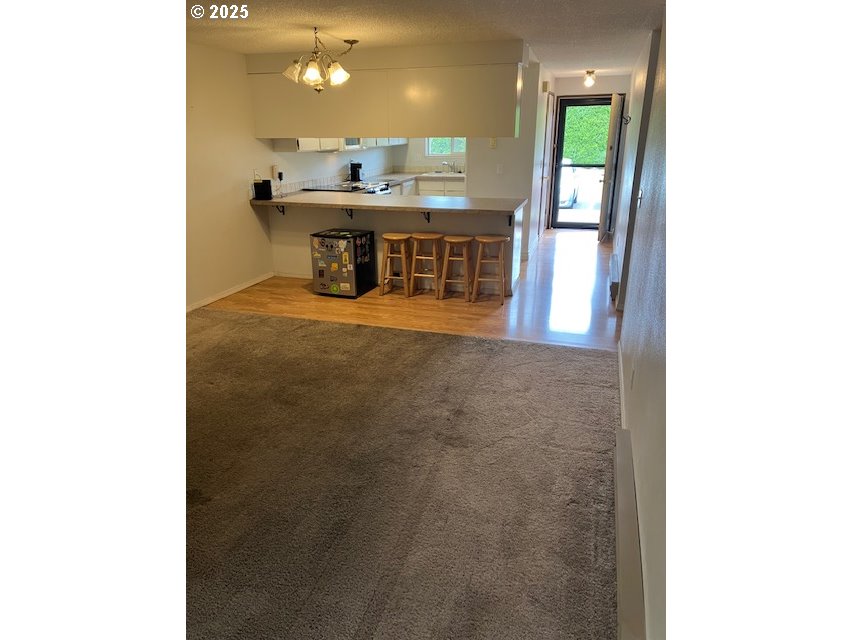 3404 19th Avenue, Unit 103 Forest Grove, OR 97116 - Photo 3 of 10 a view of a bathroom with a sink and a mirror