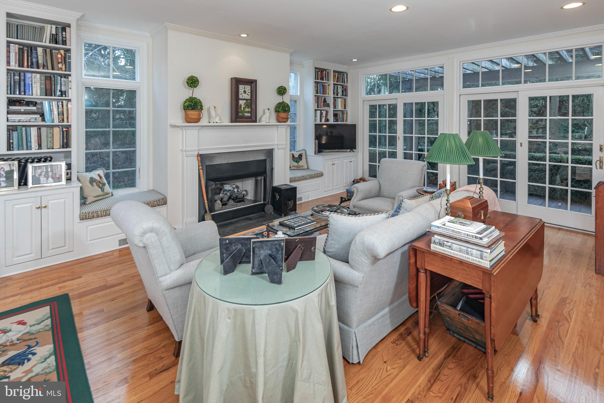 2 Windermere Way Princeton, NJ 08540 - Photo 15 of 30 a living room with furniture a fireplace and a wooden floor