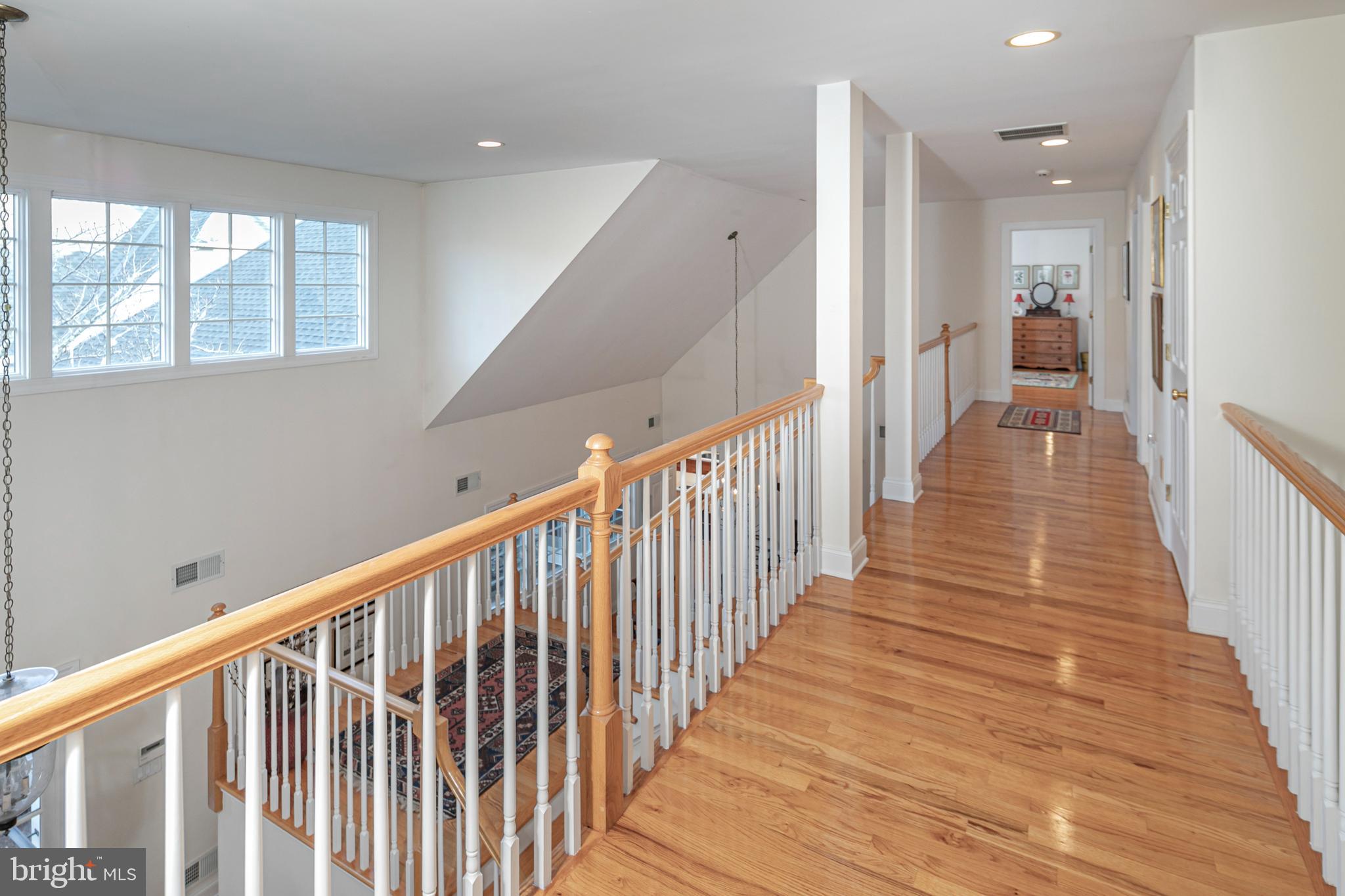 2 Windermere Way Princeton, NJ 08540 - Photo 24 of 30 a view of a hallway with wooden floor and stairs