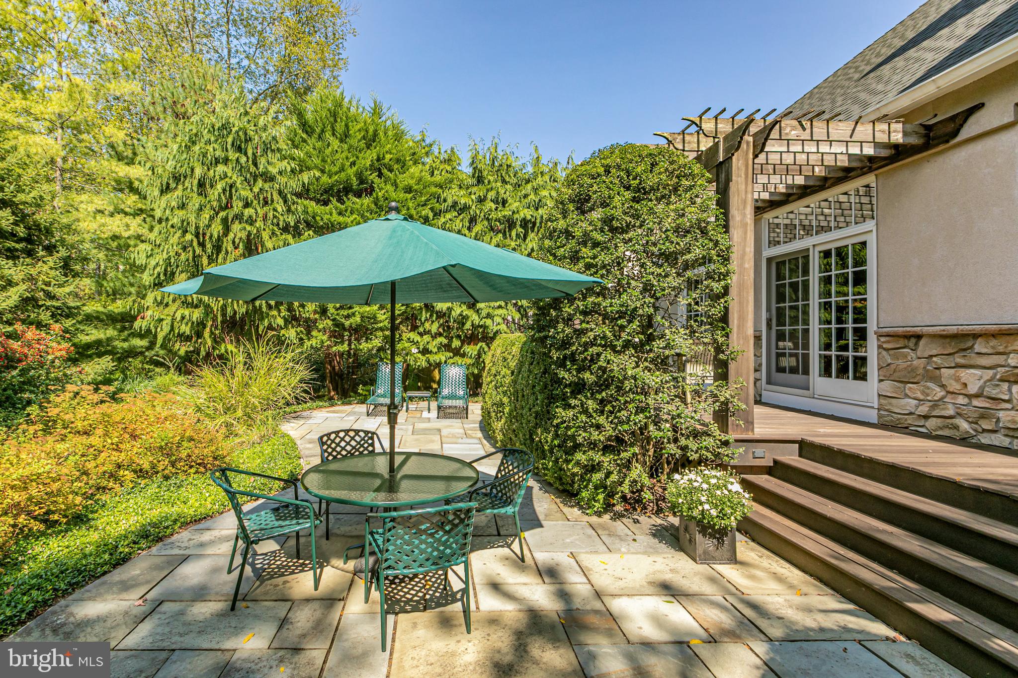 2 Windermere Way Princeton, NJ 08540 - Photo 29 of 30 a backyard of a house with table and chairs