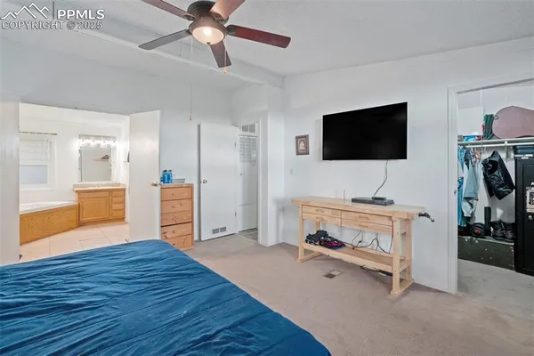 a view of a livingroom with furniture and a flat screen tv