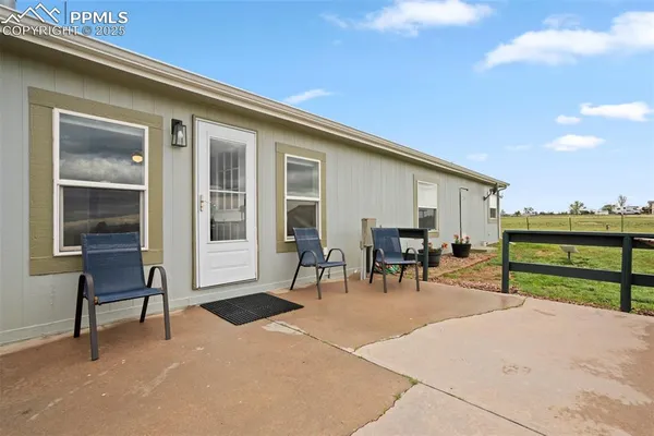 a view of a dinning room with chairs and tables