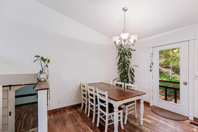 814 Mountain Road Logan, UT 84321 - Photo 5 of 42 Dining area with wood-finish flooring, white walls, and a glass-paneled door