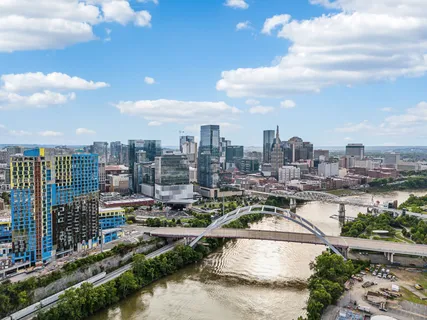 a city view with buildings and lake