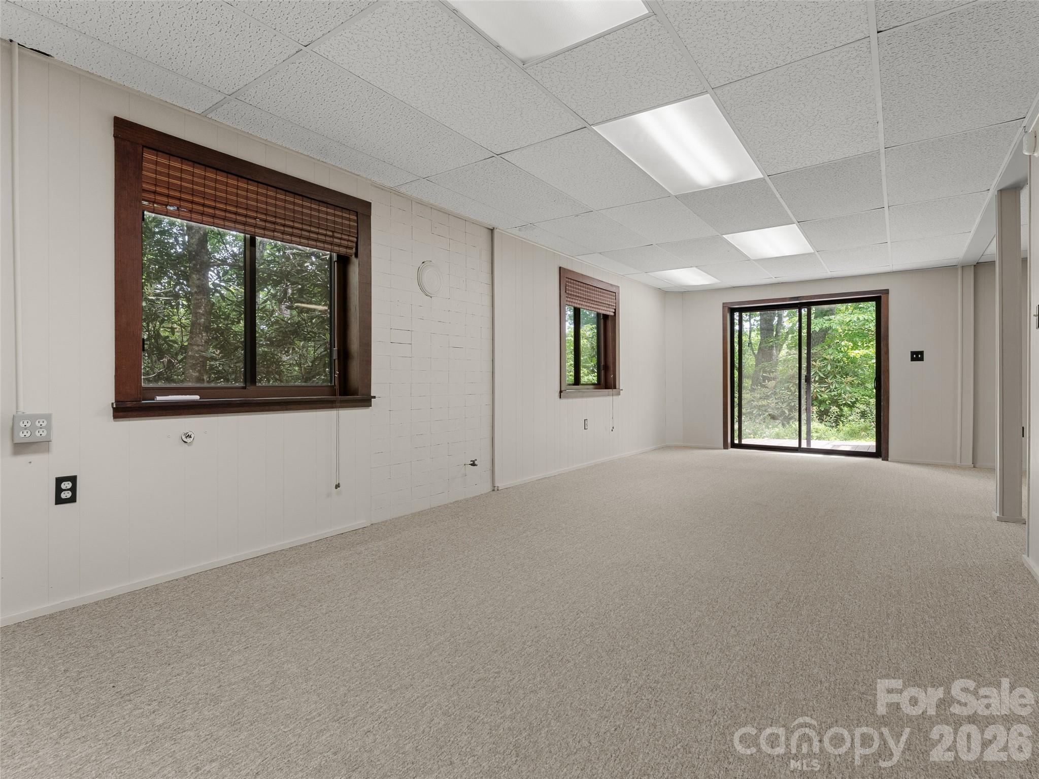 32 Honey Suckle Ridge Road Pisgah Forest, NC 28768 - Photo 26 of 35 a view of an empty room with a window