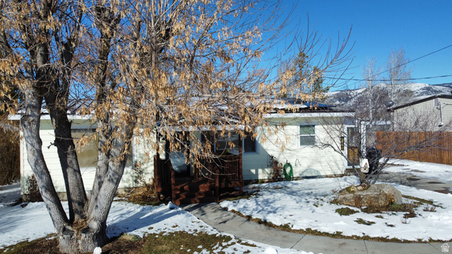 324 Stringtown Road Georgetown, ID 83239 - Photo 3 of 49 View of front facade with roof mounted solar panels