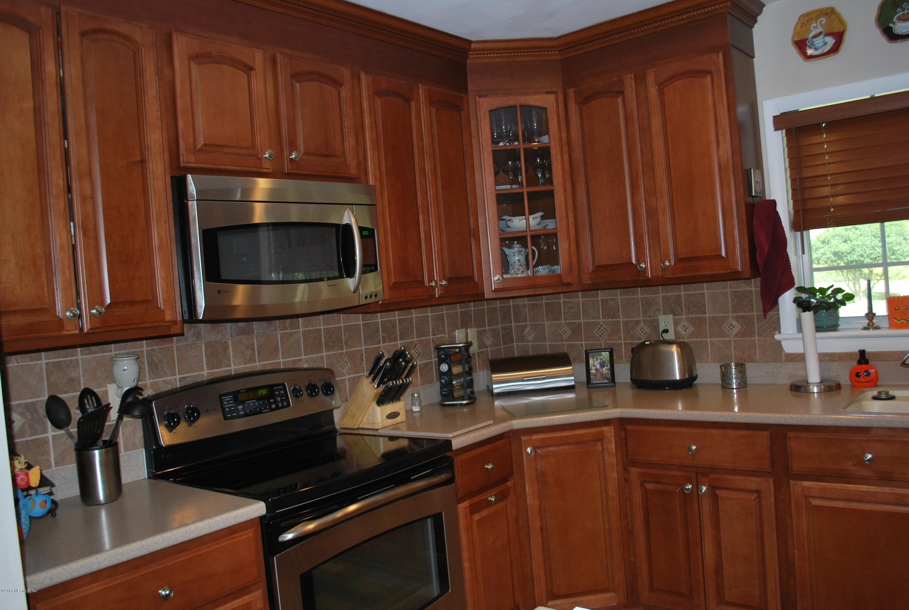 4754 Carlisle Road Jacksonville, FL 32210 - Photo 6 of 34 kitchen with tumbled tile backsplash