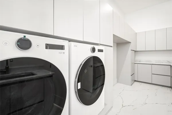 a kitchen with stainless steel appliances kitchen island granite countertop a sink and cabinets