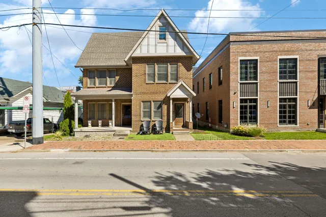 a outdoor view of a building with traffic signal lights