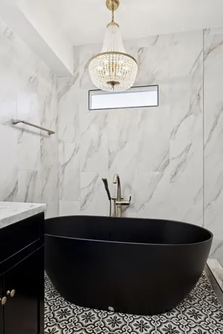 a bathroom with a shower and a sink