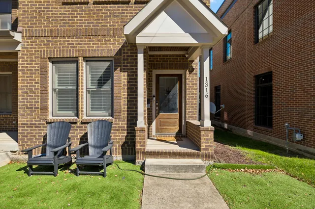 a view of house with backyard porch and outdoor seating