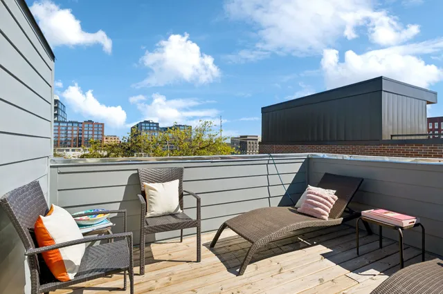 a view of a porch with wooden floor