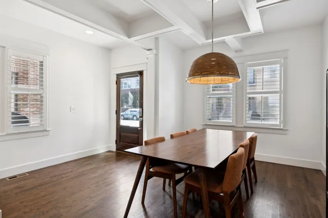 a view of a dining room with furniture and window