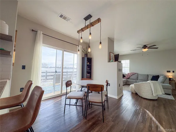 a view of a livingroom with furniture window and wooden floor