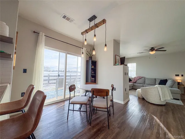 a view of a livingroom with furniture window and wooden floor