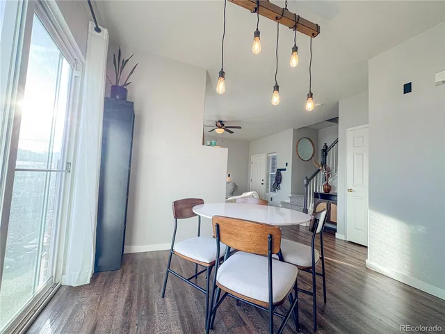 a view of a dining room with furniture window and wooden floor