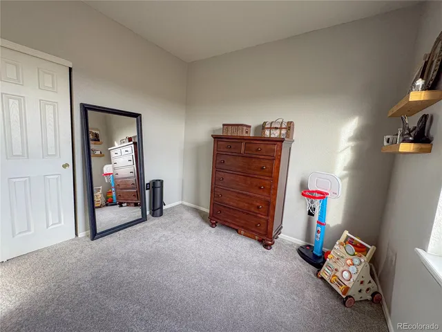 a room with furniture and a flat tv screen