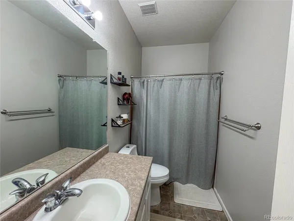 a bathroom with a sink and a toilet