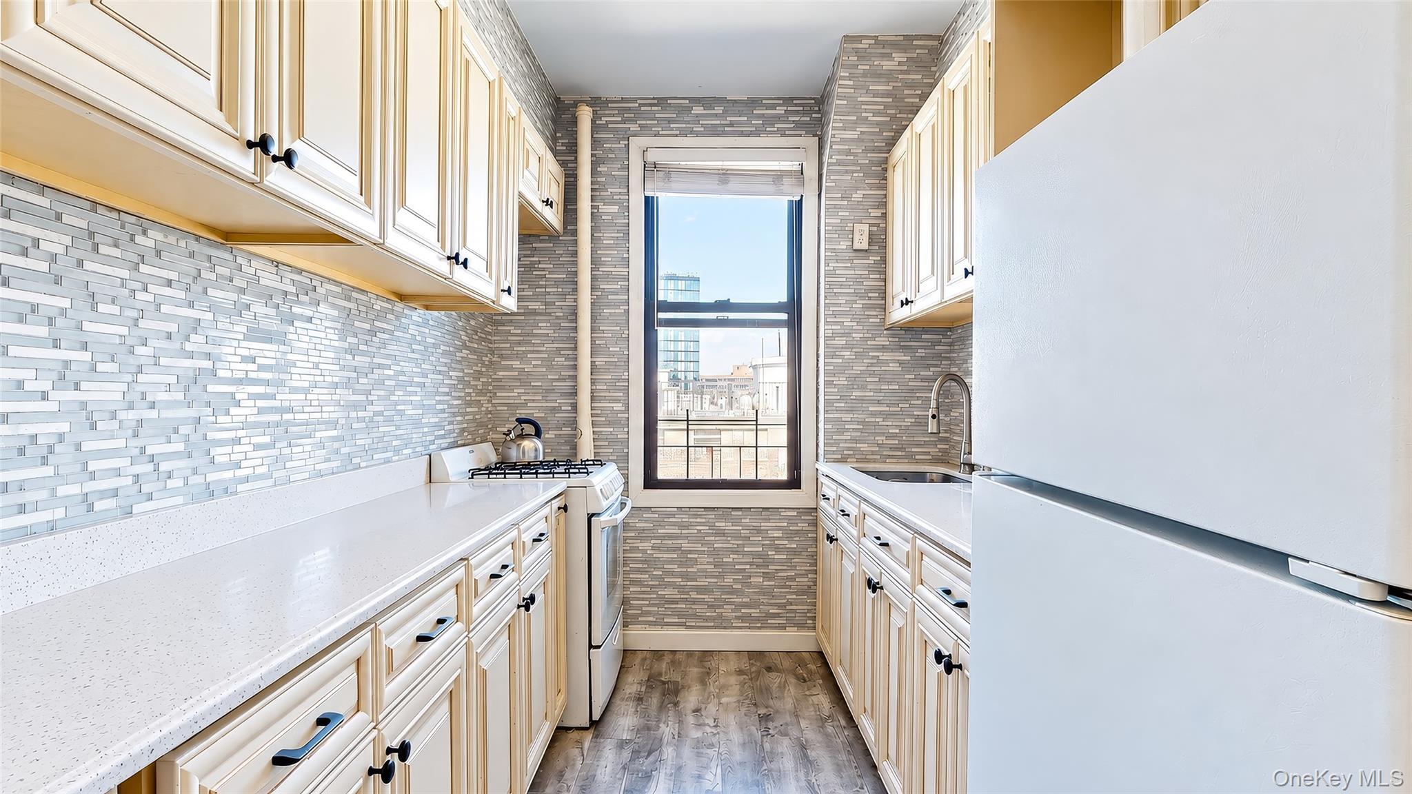 98-25 64th Road, Unit 8C Queens, NY 11374 - Photo 10 of 23 Windowed Galley Kitchen