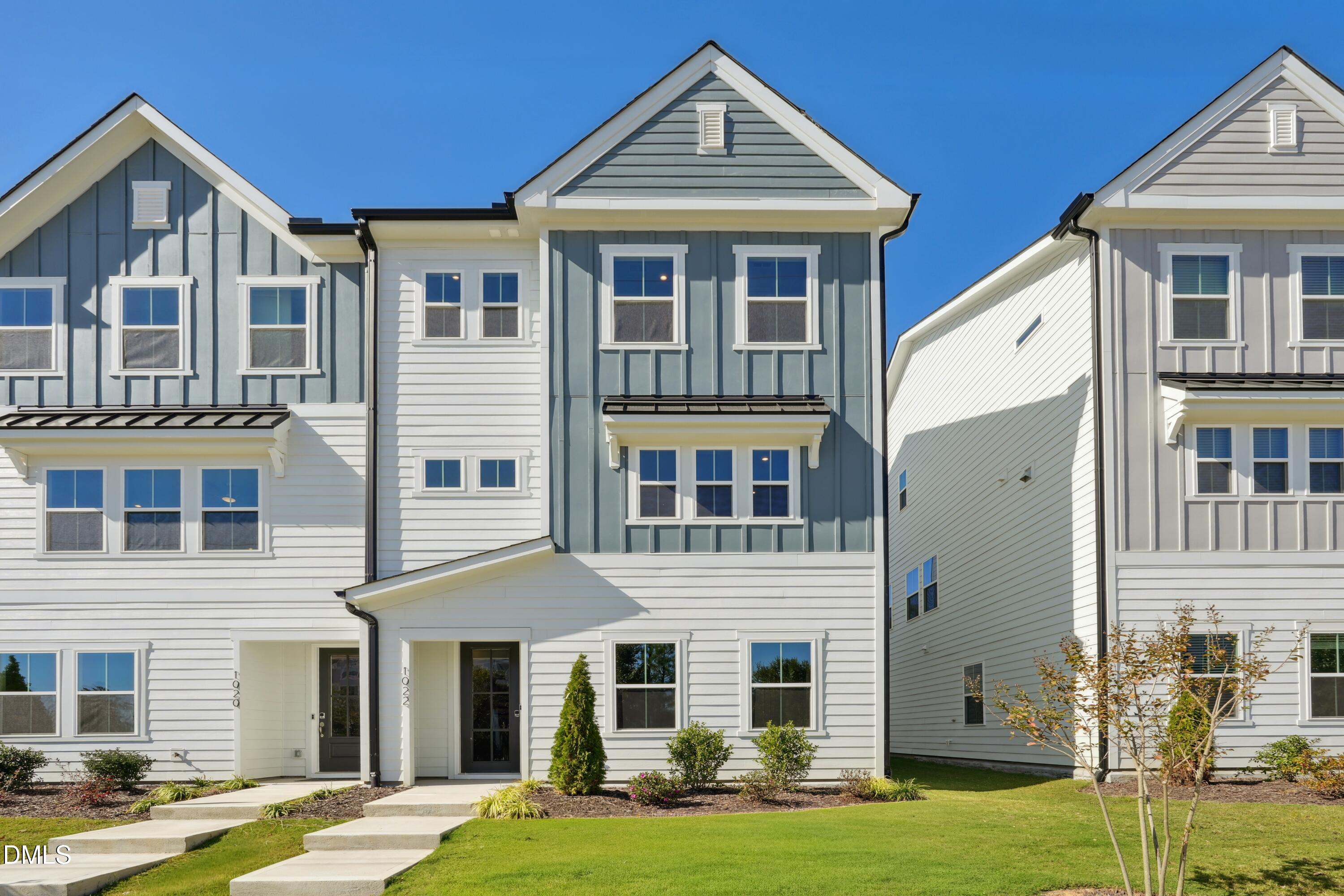 a front view of a building with a yard