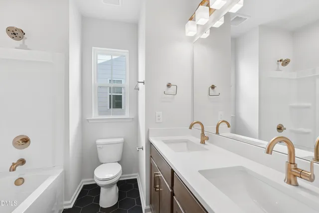 a bathroom with a shower and toilet